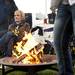 Former state senator and season ticket holder Bev Hammerstrom gets warm by a fire before the game between Michigan and Illinois on Saturday. Daniel Brenner I AnnArbor.com